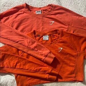 Gymshark Orange Tone, two Crewneck crop Sweatshirts, hardly worn.